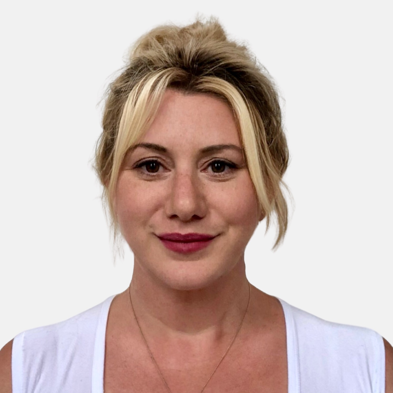 A headshot of a woman (Anna Harper) in front of a white background.